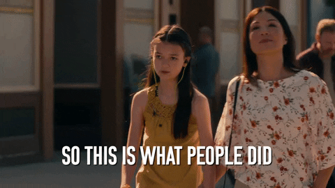 A mother with her daughter and saying, "So this is what people did before the Internet."