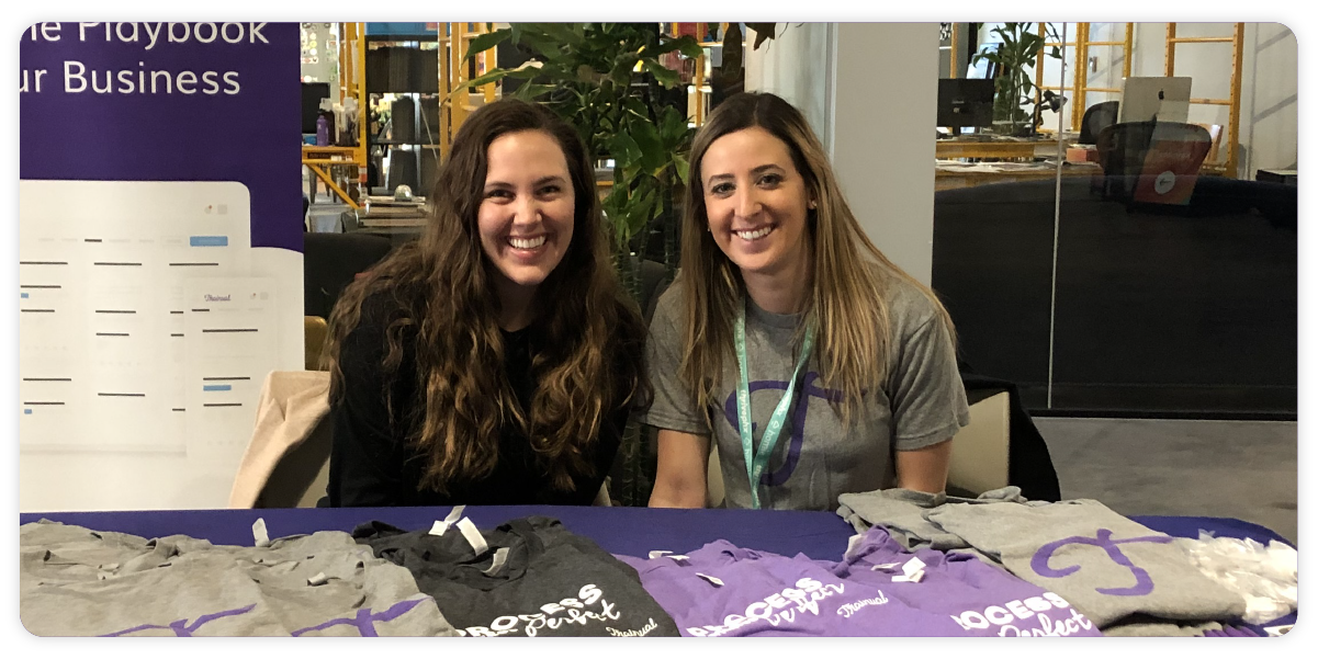 Two Trainual team members at an employee development event